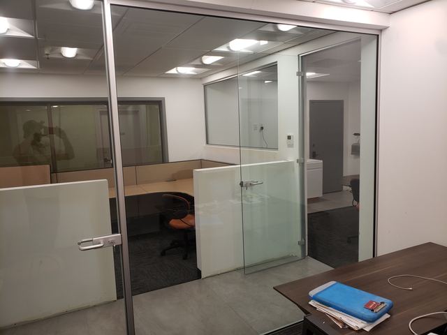 Framed glass office walls and doors with frosted lower panels