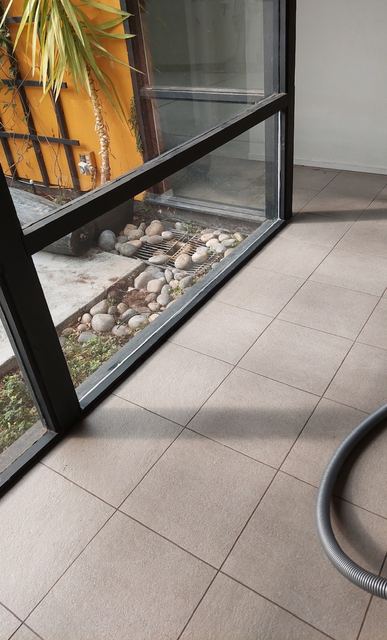 New lower glass panel in the steel-framed glass wall